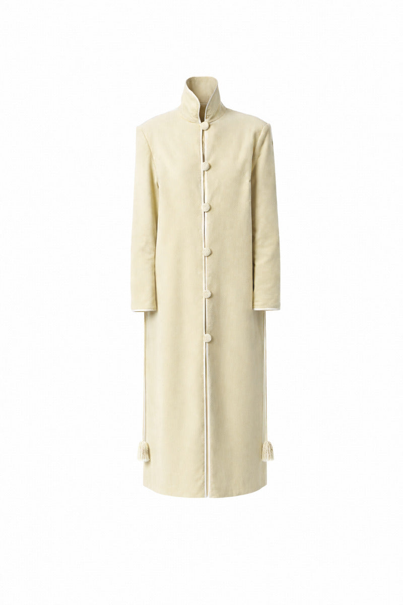 Ivory velvet coat by Delegan displayed on a ghost mannequin, front view showing smooth fabric and tailored fit.