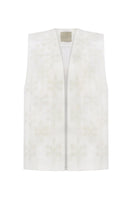 White milk-embroidered vest by Delegan displayed on a ghost mannequin, showcasing the front design and embroidery details.