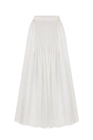 White maxi skirt with hand-embroidered tie from DELEGAN displayed on a ghost mannequin front.