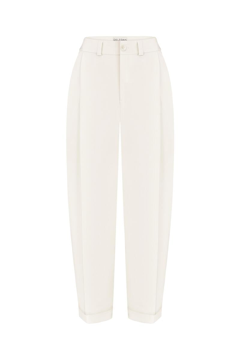 White DELEGAN pants displayed on a ghost mannequin, front view showing slim-fit design and clean, minimalist style.