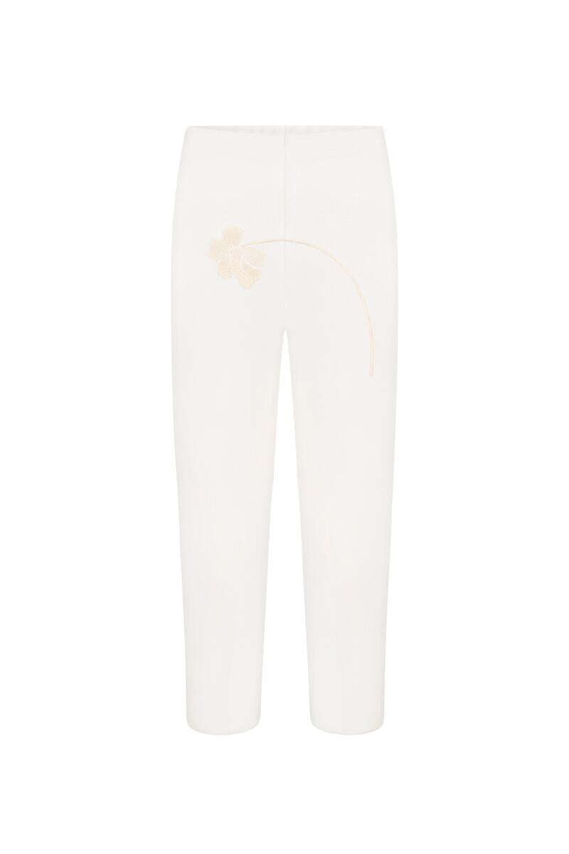 White BLOSSOM CAPRI pants by DELEGAN displayed on a ghost mannequin, showing front view of slim-fit design and soft fabric.