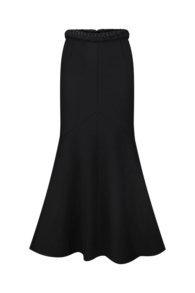 Black KOSSA midi skirt by DELEGAN displayed on a ghost mannequin, showcasing the sleek, fitted design and smooth fabric.