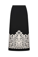 DELEGAN PLAKHTA filigree midi skirt displayed on a ghost mannequin, showcasing intricate details and elegant midi length.