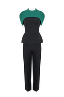 Joanna Andraos midnight black co-ords set featuring top and pants with a detachable emerald cape, front view.
