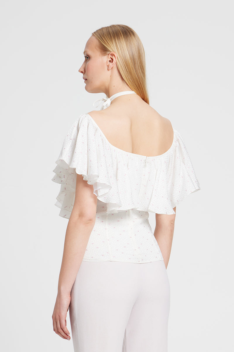 White GIGI TOP by Nara Niro, stylish casual blouse with a relaxed fit, displayed on a hanger.