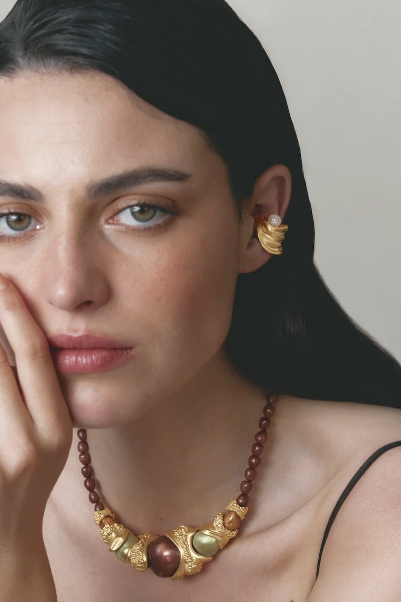 Jude Benhalim Gravity Ear cuff earrings, sleek and modern silver ear cuff with minimalist design, worn on the ear.