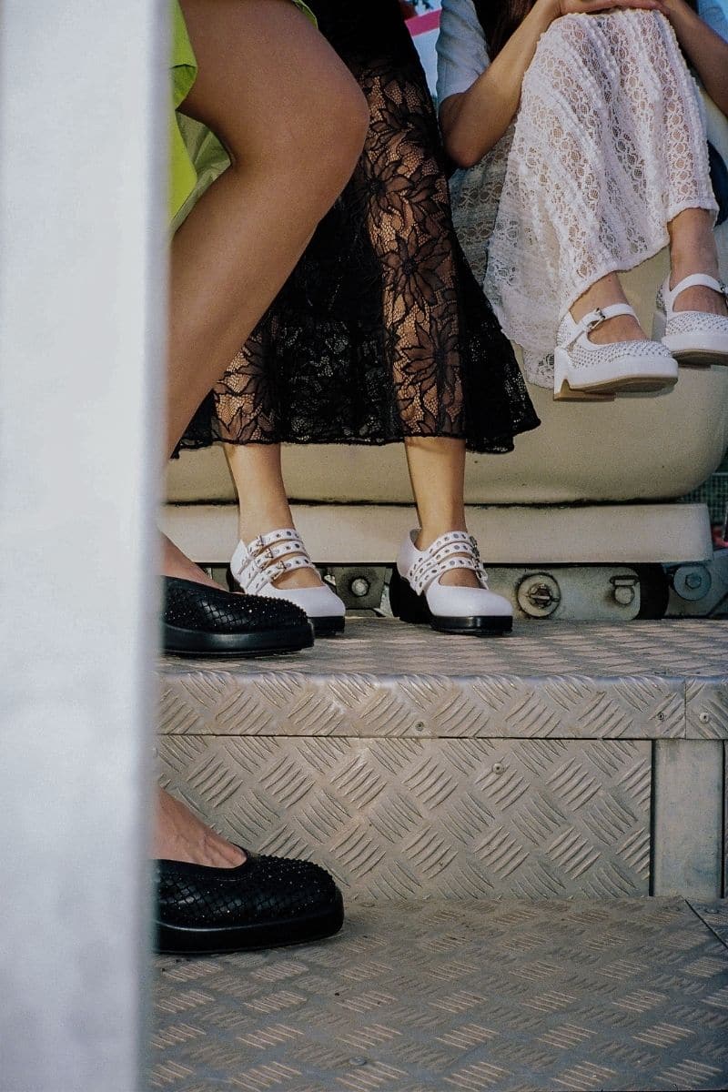 Black Gvasalia slingback heels with decorative gems, featuring a stylish open-back design and pointed toe.