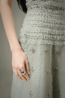 HAPPY CLOTHING CULT MIA X strapless stone organza gown in soft mint gray with a terry texture and elegant design.