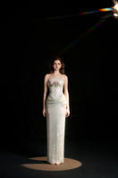 Elegant ivory sequin gown featuring a draped corset design by HACCHIC COUTURE, perfect for formal occasions.