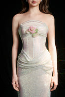 Elegant ivory sequined gown with draped corset design by HACCHIC COUTURE, featuring intricate detailing and a flowing silhouette.