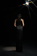 Black Amelia strap gown by HACCHIC COUTURE, featuring elegant design and sleek fabric, perfect for formal occasions.