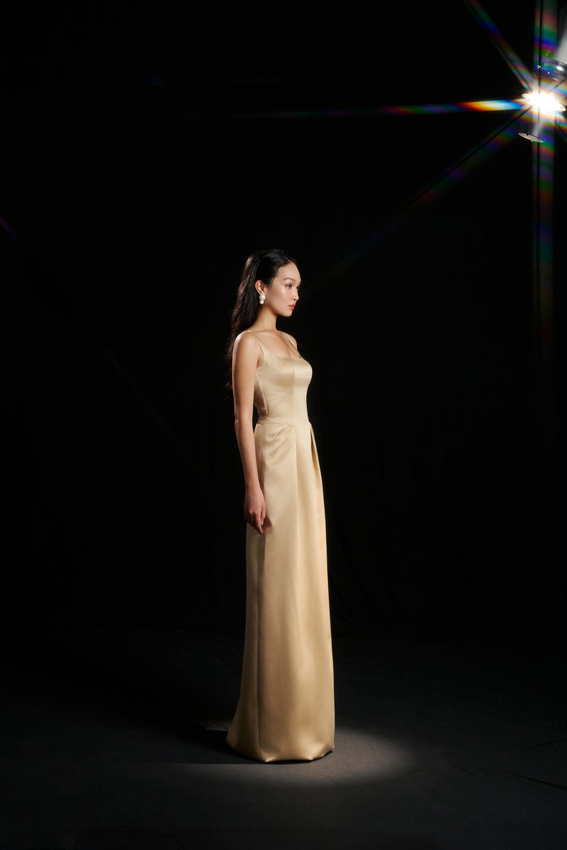 Light yellow Amelia strap gown by HACCHIC COUTURE featuring elegant design, fitted bodice, and flowing skirt, perfect for formal occasions.