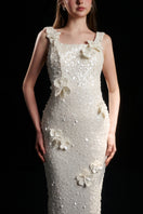 Elegant ivory pearl floral sequin gown by HACCHIC COUTURE featuring intricate floral and sequin detailing.