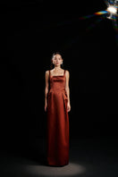 HACCHIC COUTURE Amelia strap gown in champagne orange, featuring elegant design and flowing fabric for formal occasions.