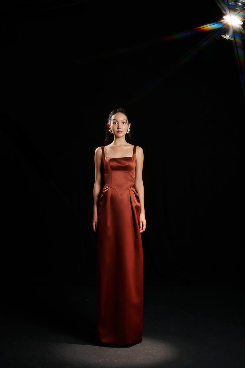 HACCHIC COUTURE Amelia strap gown in champagne orange, featuring elegant design and flowing fabric for formal occasions.