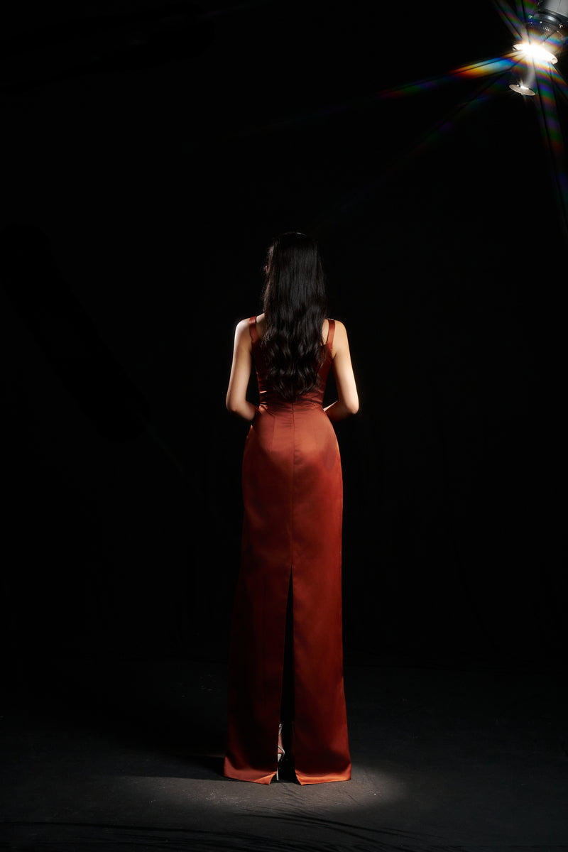 HACCHIC COUTURE Amelia strap gown in champagne orange with elegant draping and thin shoulder straps, perfect for formal occasions.