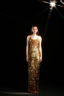 Gold sequined strap gown by HACCHIC COUTURE featuring a fitted silhouette and elegant design, perfect for formal occasions.