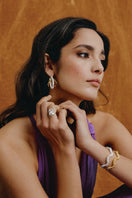 Jude Benhalim Harmonia Hoops earrings featuring mixed metal design on a model showcasing stylish jewelry.