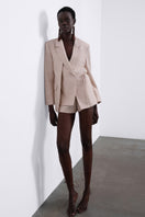 SÉLONE HELIA Relaxed Shorts in stone color, casual fit with soft fabric, displayed on a neutral background.