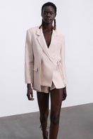 SÉLONE Helia wrap blazer in stone, tailored blazer with a wrap design, featuring a neutral stone color and elegant fit.