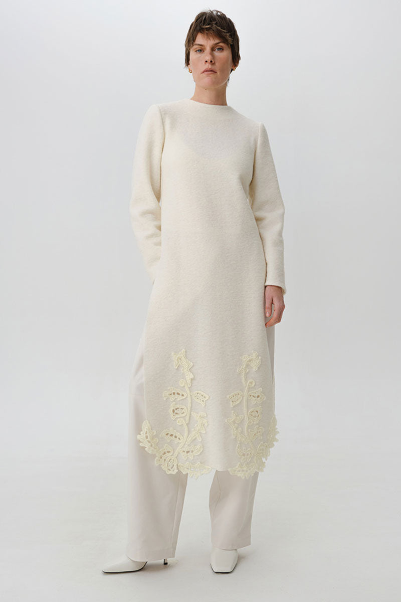 High-resolution image of a DELEGAN statement wool midi dress featuring a stylish, textured design perfect for elegant occasions.
