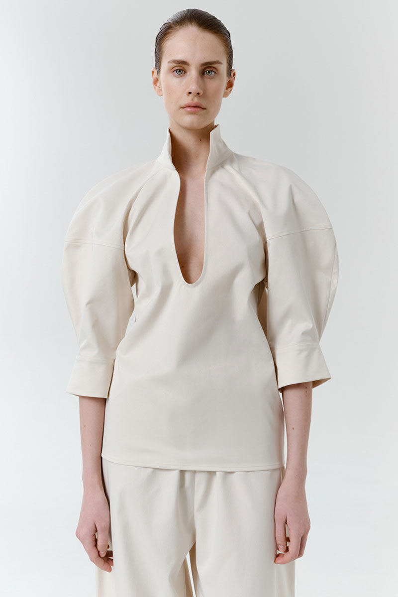 Gray-beige structure shirt by DELEGAN featuring a tailored fit, button-up front, and classic collar, displayed on a hanger.