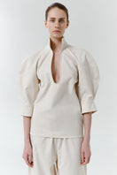 Gray-beige structure shirt by DELEGAN featuring a tailored fit, button-up front, and classic collar, displayed on a hanger.