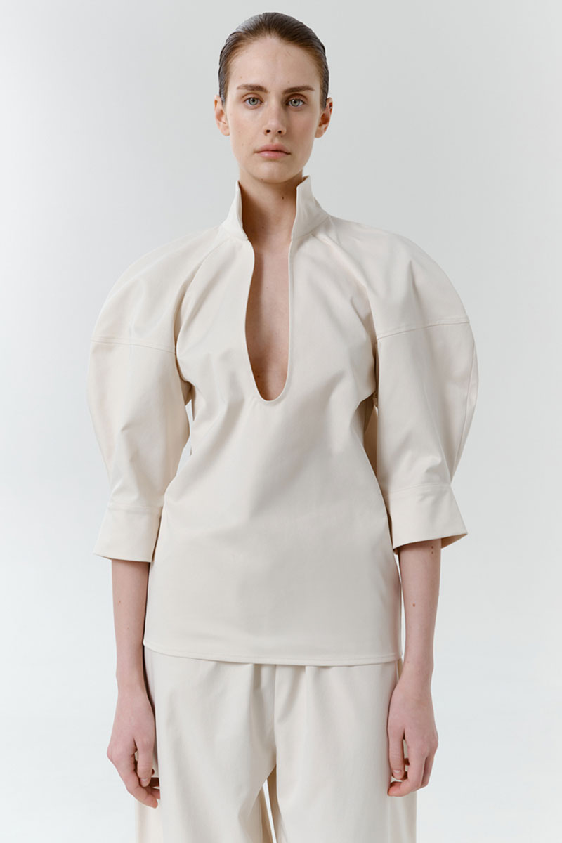 Gray-beige structure shirt by DELEGAN featuring a tailored fit, button-up front, and classic collar, displayed on a hanger.