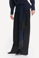 High-resolution image of a blue and black belted DELEGAN shirt featuring a stylish collar and button-front design.