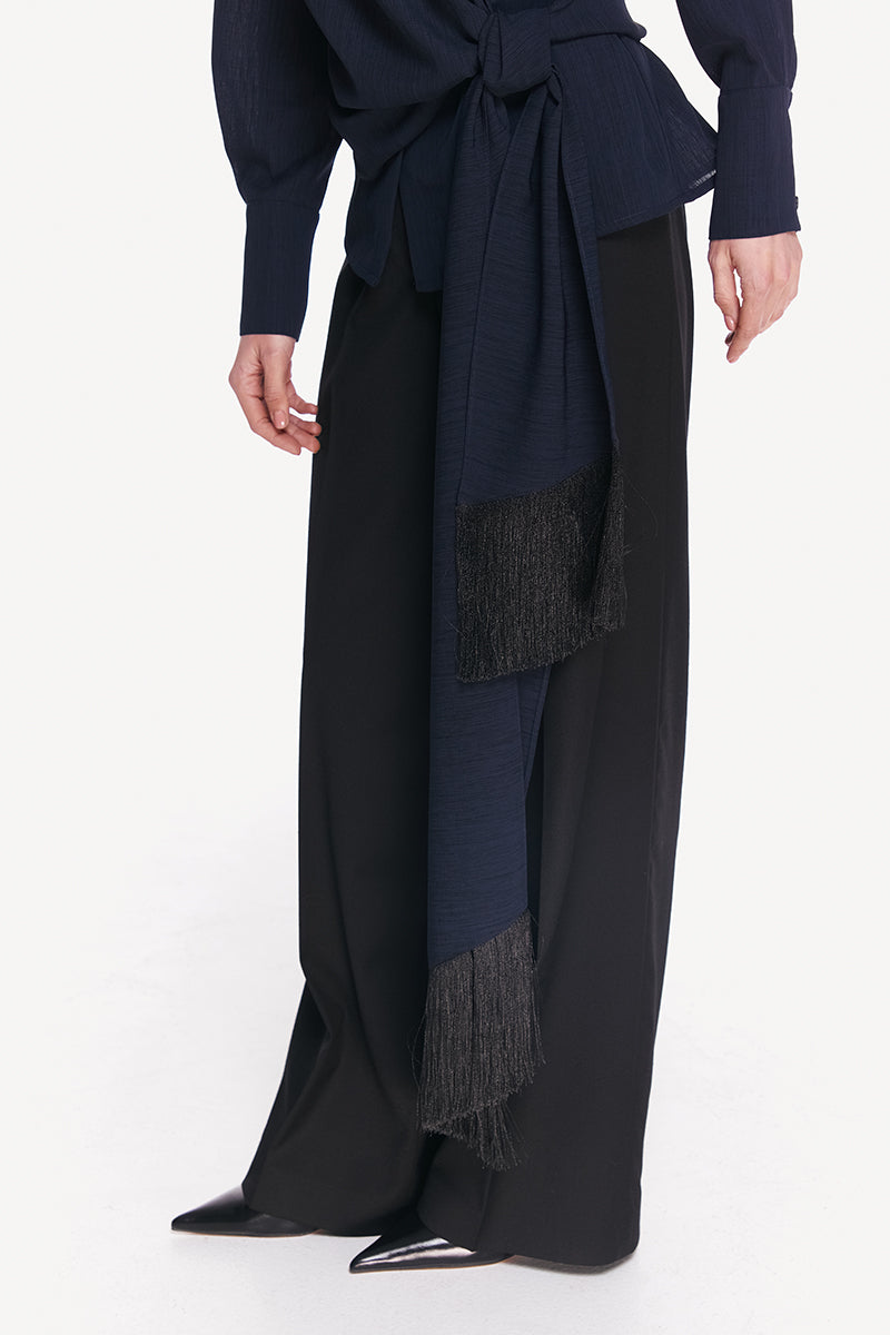 High-resolution image of a blue and black belted DELEGAN shirt featuring a stylish collar and button-front design.