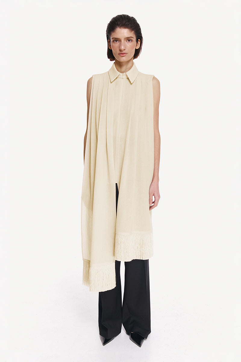 Warm ivory shirt scarf with silk fringe by DELEGAN, shown draped over a shirt, highlighting soft fabric and elegant design.