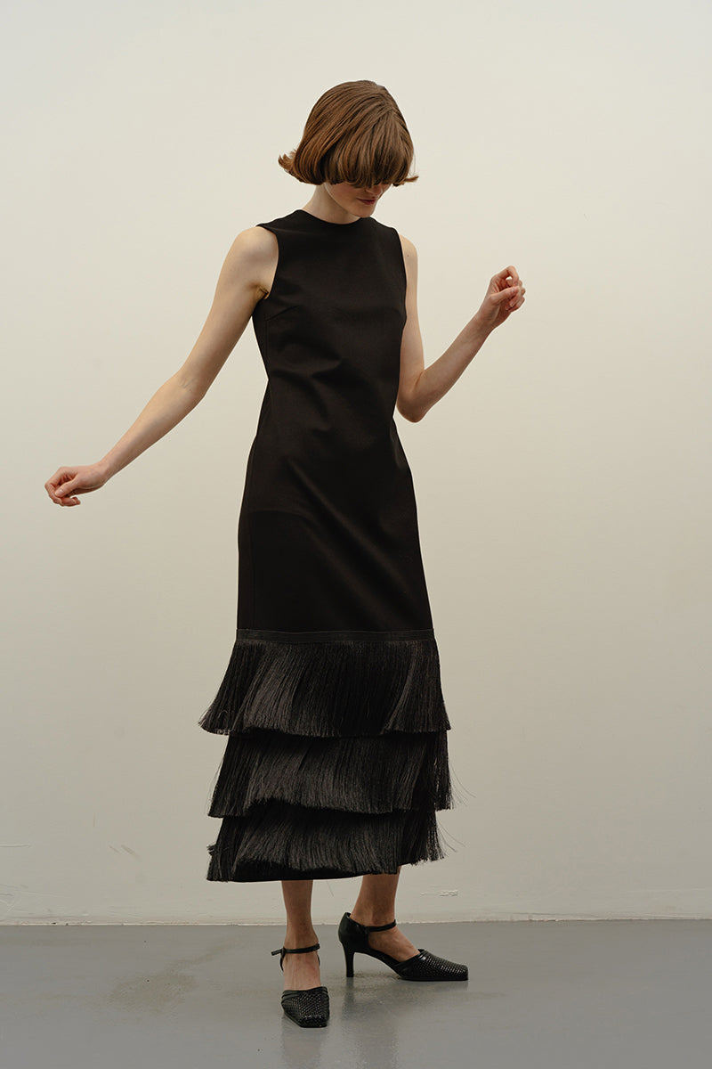 Black Bakhroma midi dress by DELEGAN featuring a sleek, fitted silhouette and elegant midi length, perfect for stylish occasions.
