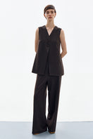 Brown Petal vest by DELEGAN, lightweight sleeveless vest with a textured fabric and stylish petal design, perfect for layered look.