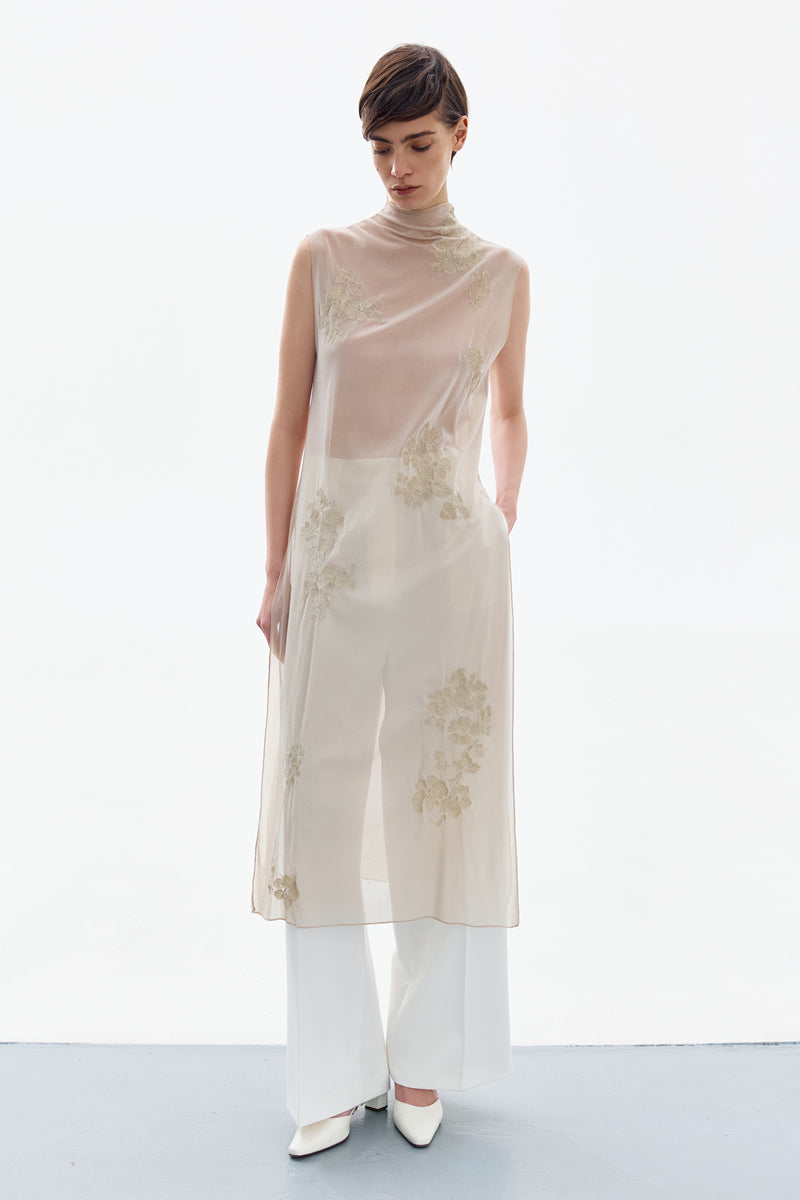 Elegant brass bloom midi dress by DELEGAN featuring a fitted bodice and flowing skirt, perfect for stylish occasions.