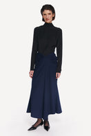 Midnight blue midi skirt by DELEGAN, featuring a flowy fabric and classic length, shown in a high-resolution image.