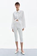 Delegan Blossom White Capri pants, high-resolution image showing stylish, comfortable white denim capris with a relaxed fit.