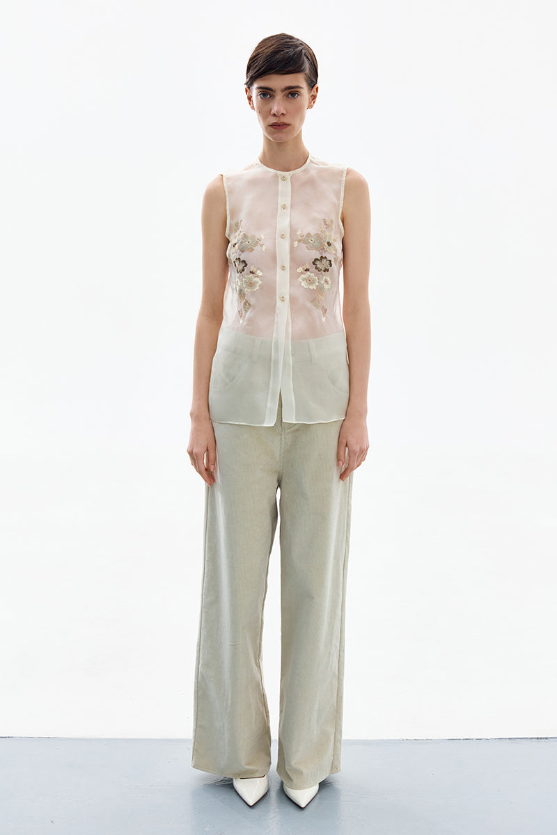 Elegant silk blossom embroidered shirt by DELEGAN featuring intricate floral embroidery on a lightweight fabric.