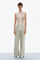 Elegant silk blossom embroidered shirt by Delegan with intricate floral embroidery and a smooth, luxurious fabric.
