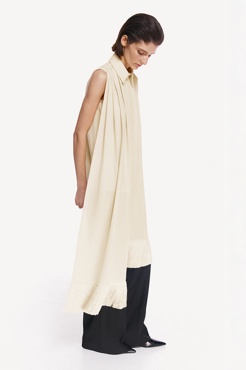 Warm ivory shirt scarf with silk fringe from DELEGAN, featuring lightweight fabric and elegant fringe detailing.