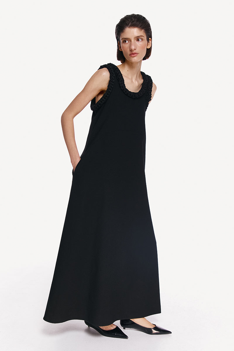 Elegant DELEGAN KOSSA Maxi Dress displayed on a model, showcasing flowy fabric and stylish design perfect for summer wear.