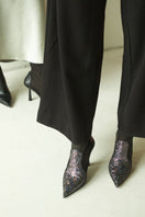 Black disco suede heeled boots by House of Atana, featuring a stylish design and pointed toe, size EU 35.