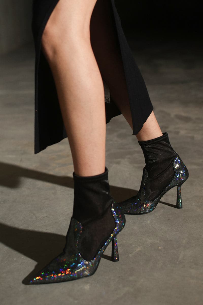 Black disco suede heels by House of Atana, stylish ankle boots with a sleek, shiny finish and high heel, size EU 35.