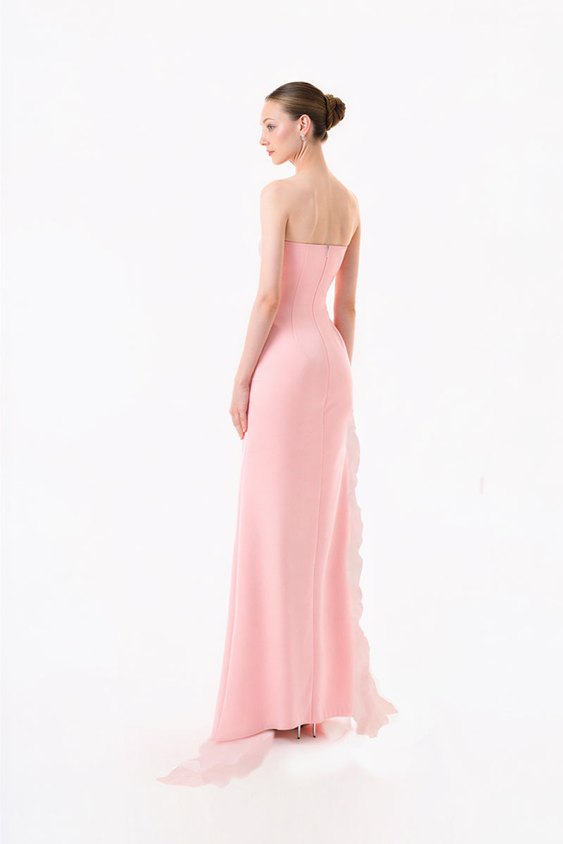 Blush pink strapless ruffle slit gown by Happy Clothing, featuring flowing fabric and elegant design for formal occasions.