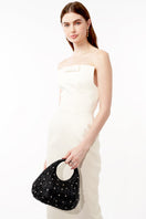 Emm Kuo Hudson raffia top handle bag in black wicker with a structured design and short top handles.