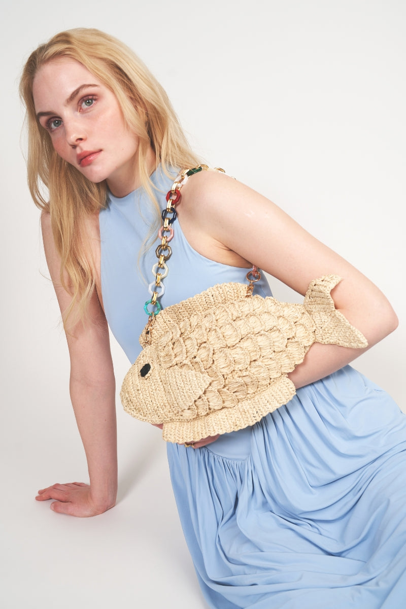 Natural HUMUHUMU clutch by Emm Kuo featuring a textured beige fabric and sleek design for stylish accessories.