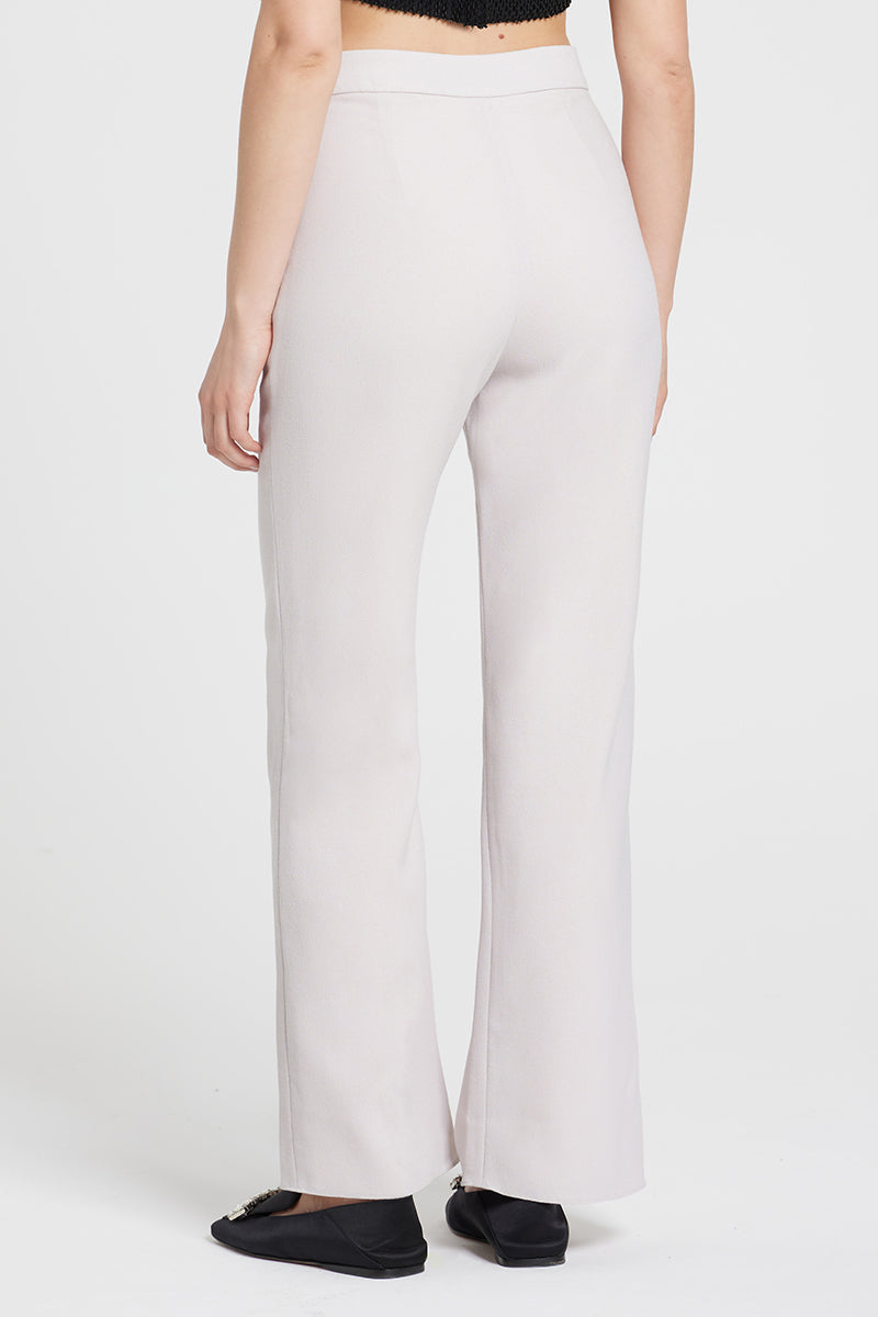 Nara Niro IDA trousers in nude color, stylish pants with a tailored fit, displayed on a plain background.