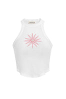Light pink IKINITA Sunrise Top displayed on a hanger, showcasing its soft fabric and stylish design.