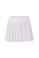 Pink polka dot mini skirt from IKINITA featuring a playful candy-inspired design on a white background.