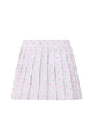Pink polka dot mini skirt from IKINITA featuring a playful, stylish design on a white background.