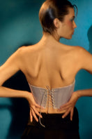 IKINITA THE SENSU corset top, featuring a fitted design with lace-up details and stylish fabric for a fashionable look.